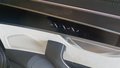 View of control buttons for electric rear seat adjustment