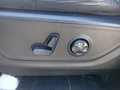 View of control buttons for electric rear seat adjustment