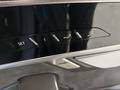 View of control buttons for electric rear seat adjustment