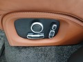 View of control buttons for electric rear seat adjustment
