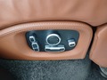 View of control buttons for electric rear seat adjustment