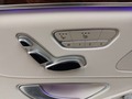 View of control buttons for electric rear seat adjustment
