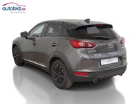 Skats no kreisās puses aizmugurē