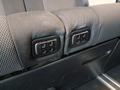 View of control buttons for electric rear seat adjustment