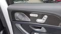 View of control buttons for electric rear seat adjustment