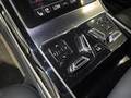 View of control buttons for electric rear seat adjustment