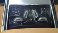 View of control buttons for electric rear seat adjustment