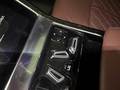 View of control buttons for electric rear seat adjustment