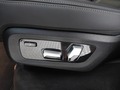 View of control buttons for electric rear seat adjustment
