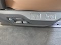 View of control buttons for electric rear seat adjustment