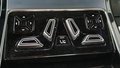View of control buttons for electric rear seat adjustment
