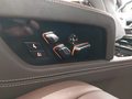 View of control buttons for electric rear seat adjustment