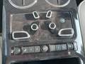 View of control buttons for electric rear seat adjustment