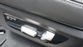 View of control buttons for electric rear seat adjustment