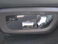 View of control buttons for electric rear seat adjustment