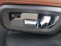 View of control buttons for electric rear seat adjustment