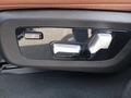 View of control buttons for electric rear seat adjustment