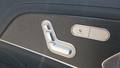 View of control buttons for electric rear seat adjustment