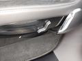 View of control buttons for electric rear seat adjustment