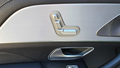 View of control buttons for electric rear seat adjustment