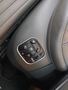 View of control buttons for electric seat adjustment