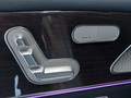 View of control buttons for electric rear seat adjustment