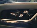 View of control buttons for electric rear seat adjustment