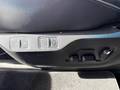 View of control buttons for electric rear seat adjustment