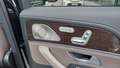 View of control buttons for electric rear seat adjustment